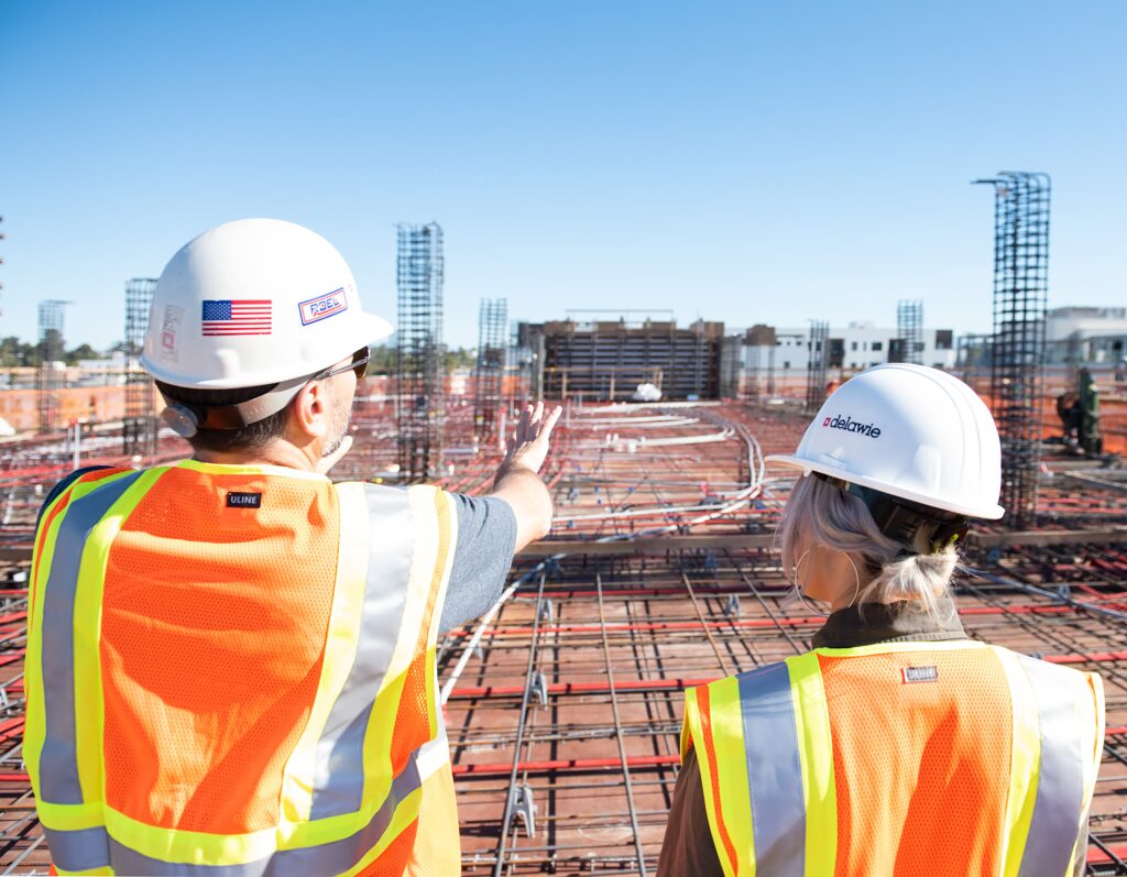 workers in hard hats discussing project